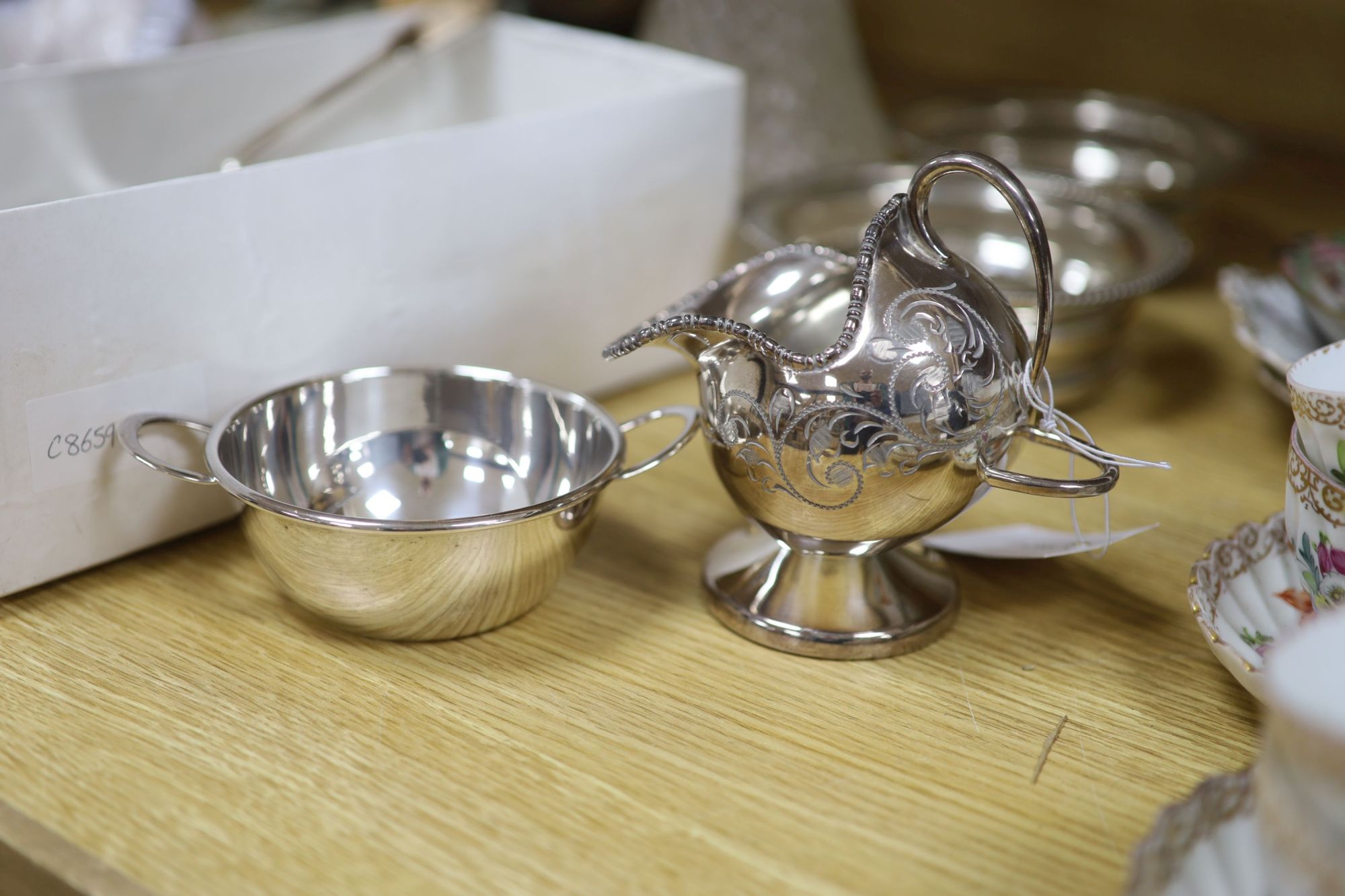 A group of mixed plated wares including a pair of wine coasters, 15.5cm, napkin rings, flatware, etc.